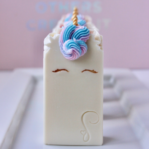 white unicorn soap with blue and pink piped hair