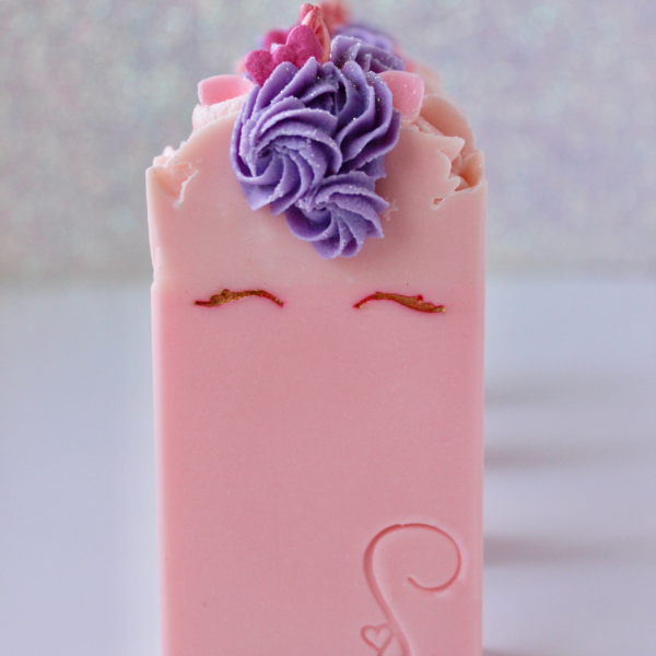Front of Pink Unicorn Soap with purple piped hair