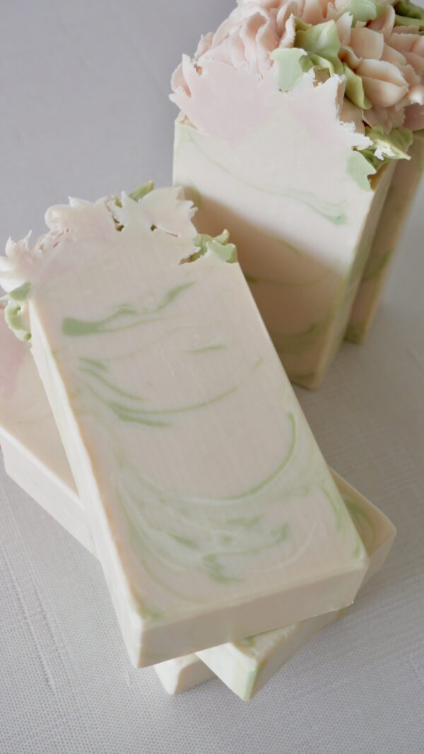 Cut view of pink peony bar with green and white swirls inside