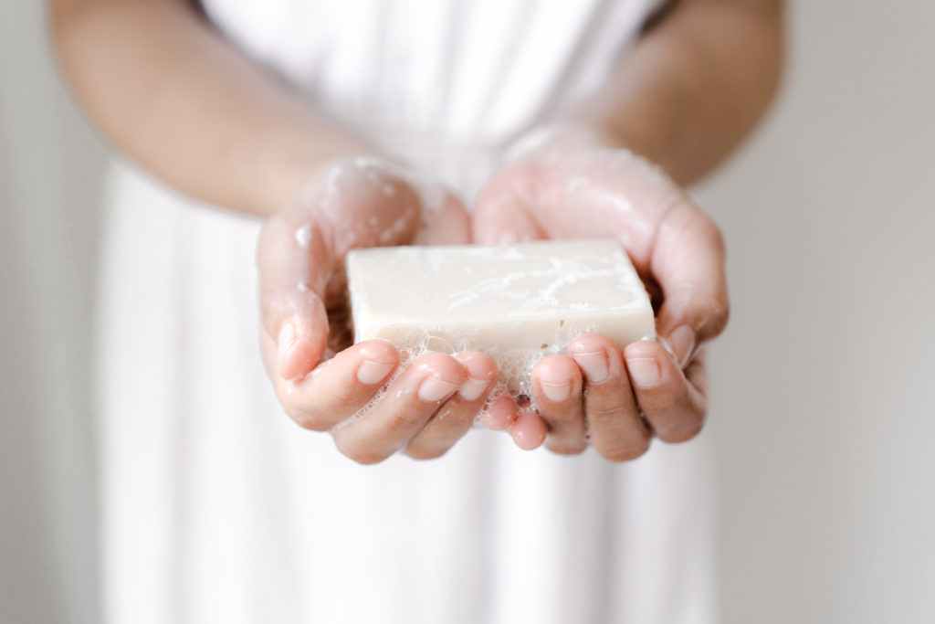 woman with a bar of soap in her hands