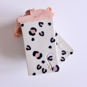 Gray soap bar with black and pink leopard print inside bar