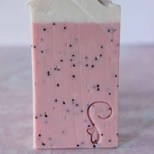 pink watermelon soap with poppy seeds inside with white top and plastic flamingo and paper straw